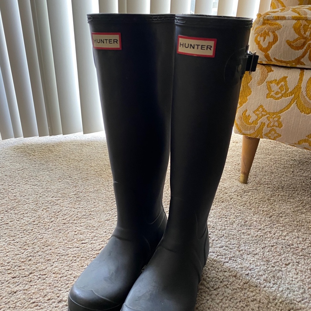 Black tall hunter boots